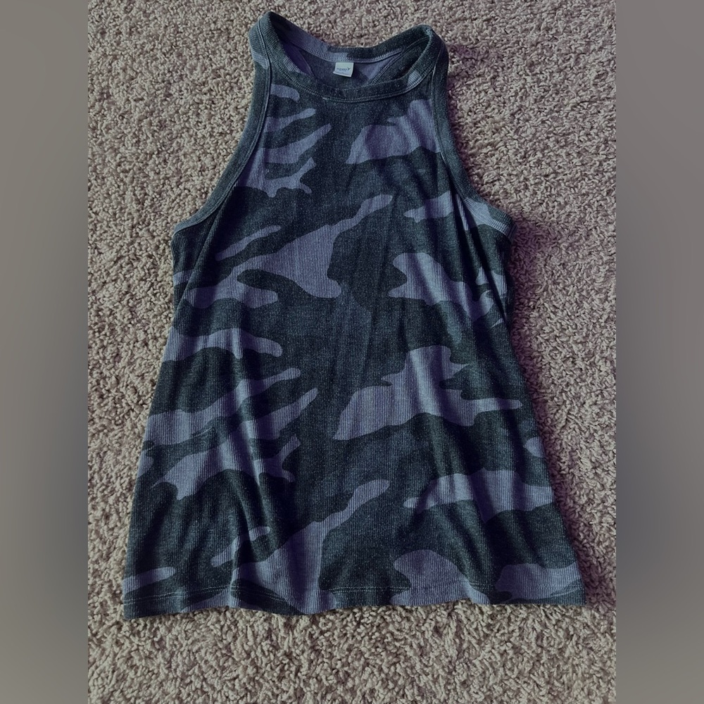 Nice tank top. Wash tag was cut off. Good material. Not cropped.
